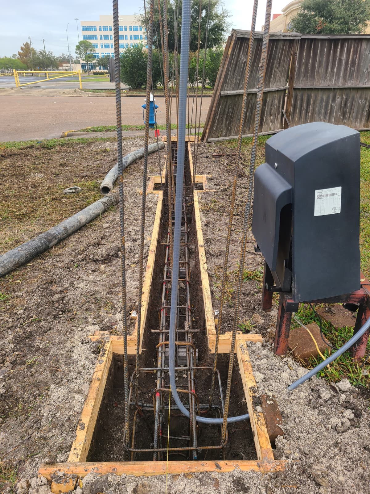 Rebar detail with vertical bars tied into footing for fence posts