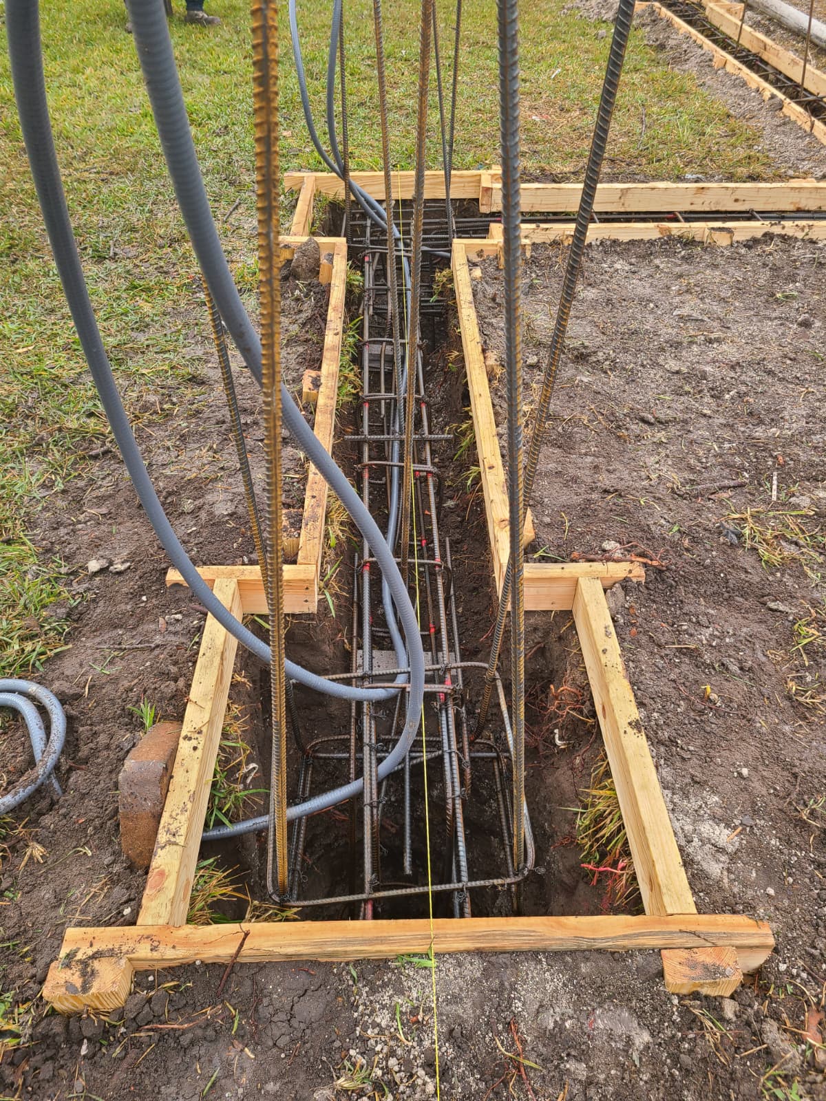 Rebar and conduit installed along structural footing