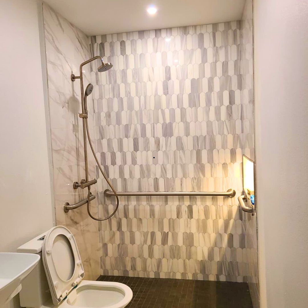 After small bathroom remodel in Houston with walk-in shower and grab bars