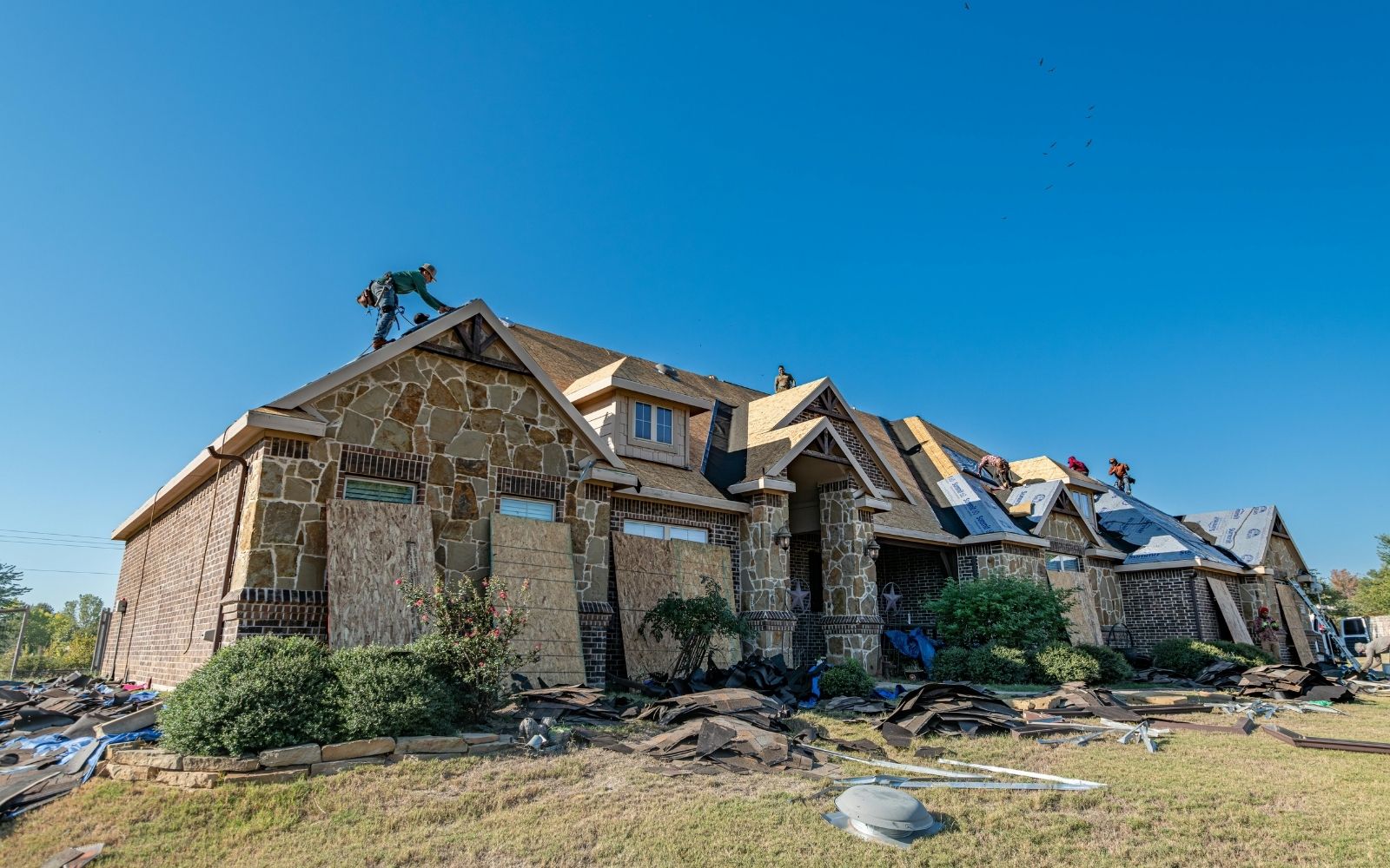 Family standing outside their Houston home with a new roof
